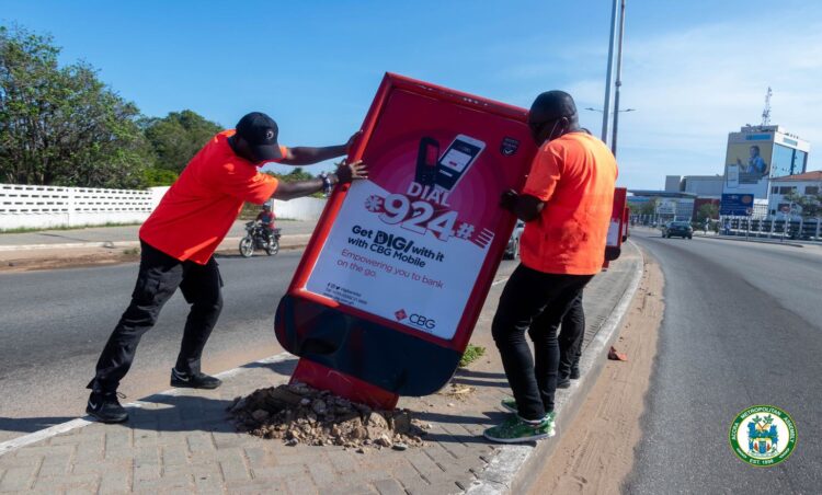 AMA removes  unauthorised signages along John Evans Atta Mills High Street in Accra