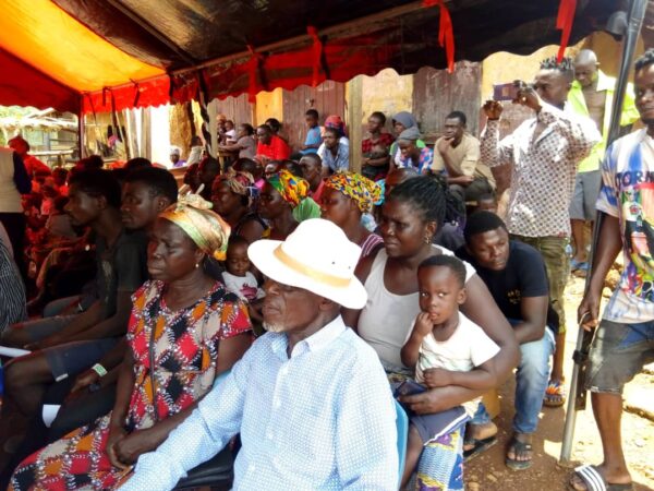 A gathered residents of Odumase community pays attention to the address by the Hon. MP Joseph Frempong