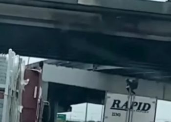 Man dancing on top of a moving truck dies after hitting overpass