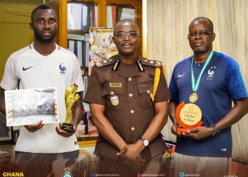 SCO. Odoi and SGT. Azameti present awards to DG of Prisons