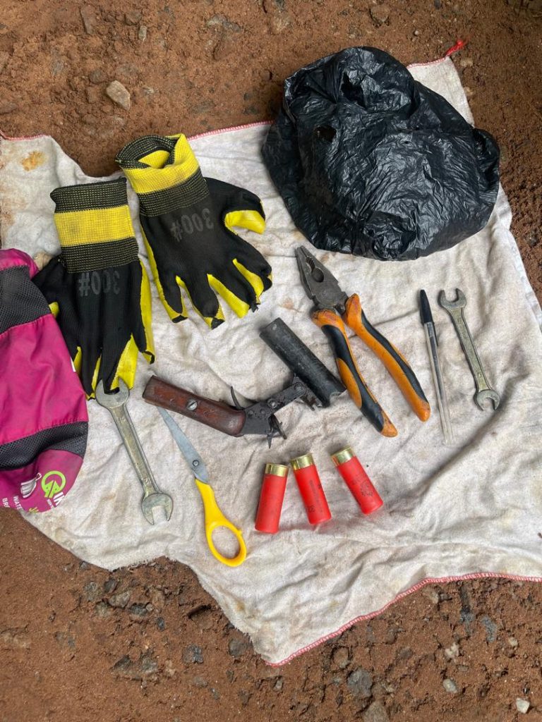 A locally manufactured pistol, three live cartridges, two spanners, a plier, a pair of gloves, a single pair of scissors retrieved from the motorbikes boot.