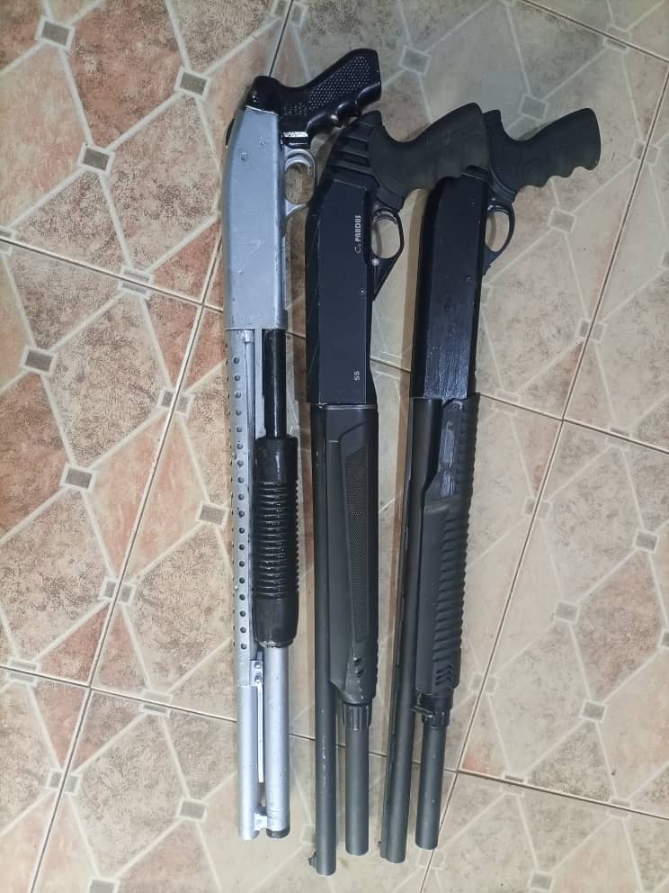 Three pump-action guns—a Pardus pump-action, a Hulglu Atroe pump-action, and another unidentified pump-action firearm uncovered in his pickup