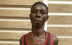 The suspect, Samuel Armah aka Kofi Nyan in police grips 